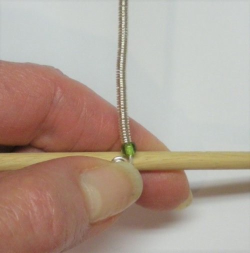 Judy Larson's Coiled, Beaded Slide - , Contemporary Wire Jewelry, Coiling, Coiling Wire, Wire Coiling, Push the bead and coil tightly to the spiral